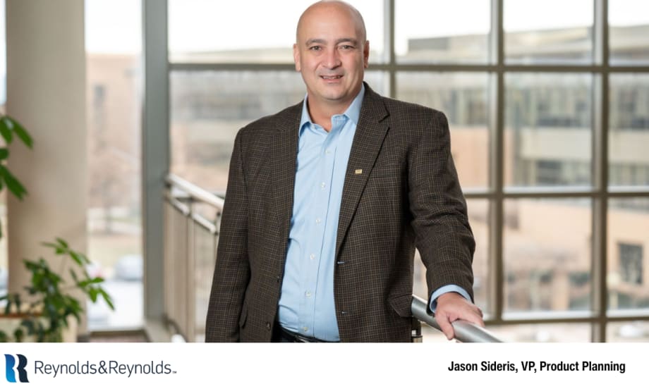 Jason Sideris, vice president of product planning at Reynolds and Reynolds, standing indoors at a company facility.