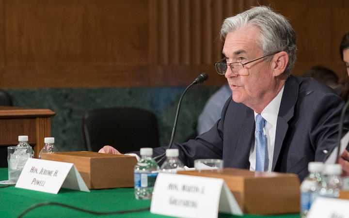 Fed Raises Interest Rate, Lowers Growth Forecast