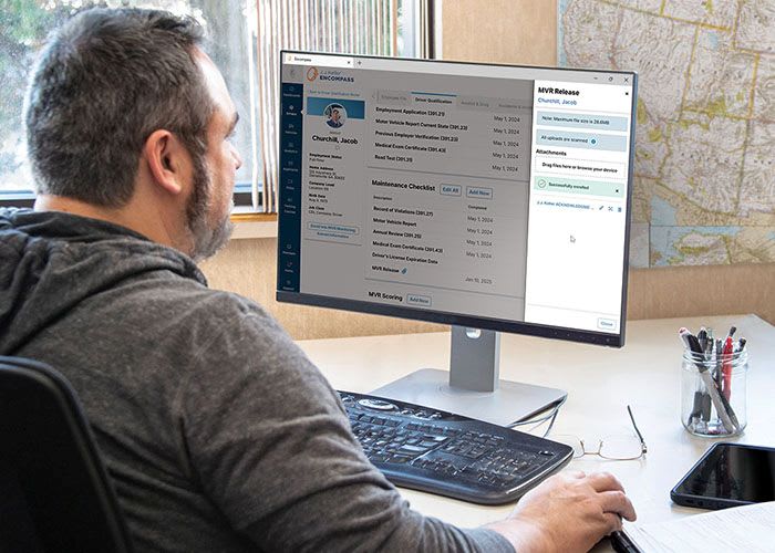 Shop manager with J.J. Keller fleet management system.
