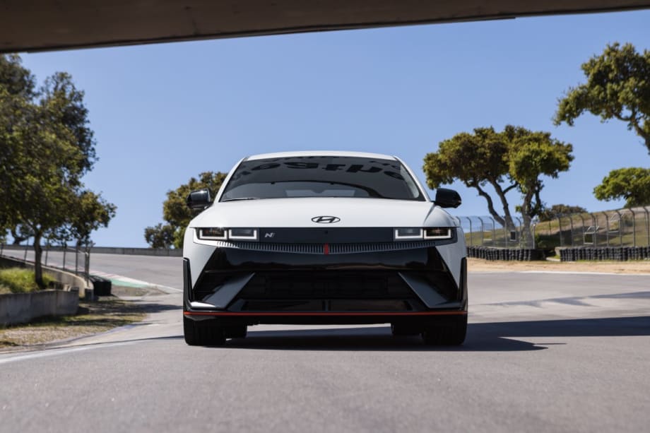 Front view of a white 2025 Ioniq 5 N parked on a road.