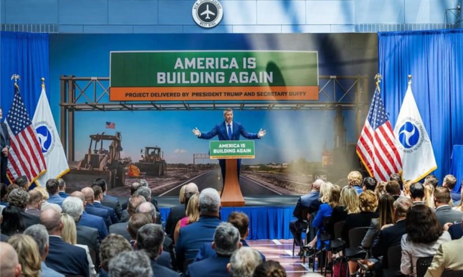 Transportation Secretary Sean Duffy speaks at a podium in front of a crowd.