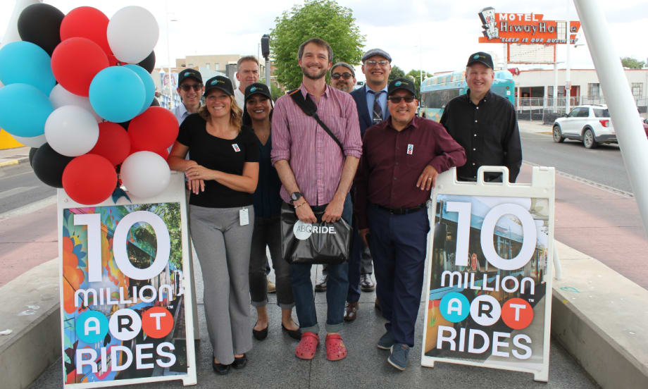 Rhett Sander-Spencer, ART's 10 millionth rider, posing for a picture with transit professionals.