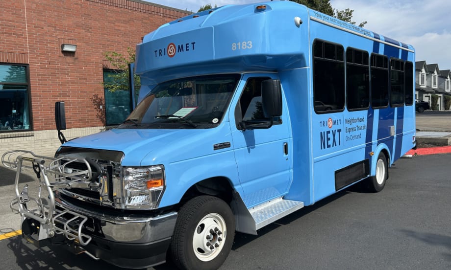 A blue TriMet NEXT bus.