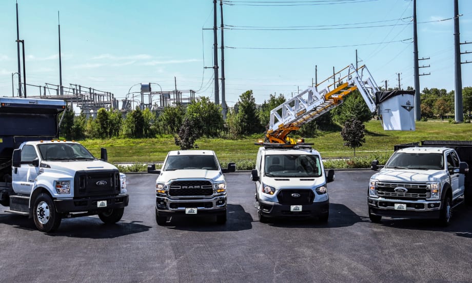 A lineup of work trucks and vans from City Rent a Truck.