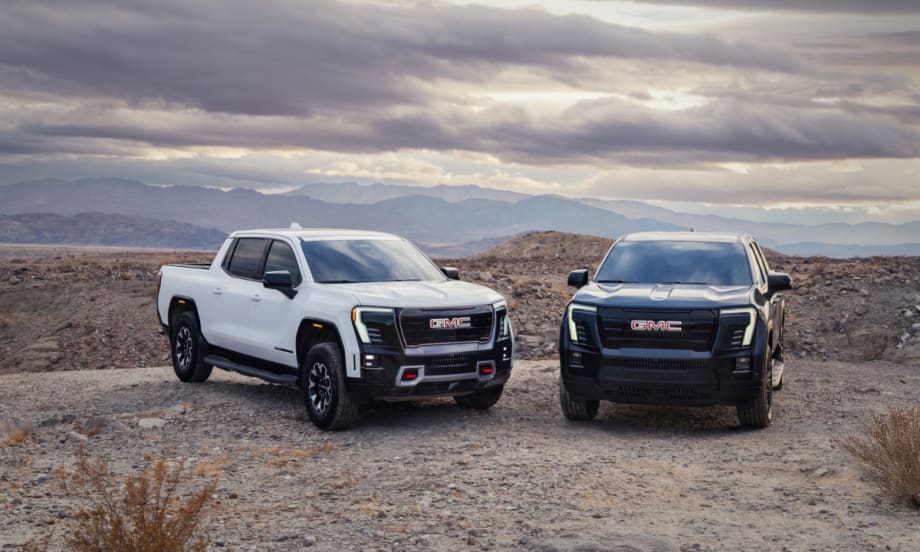 A white 2026 GMC Sierra EV AT4 trim and black Elevation trim.