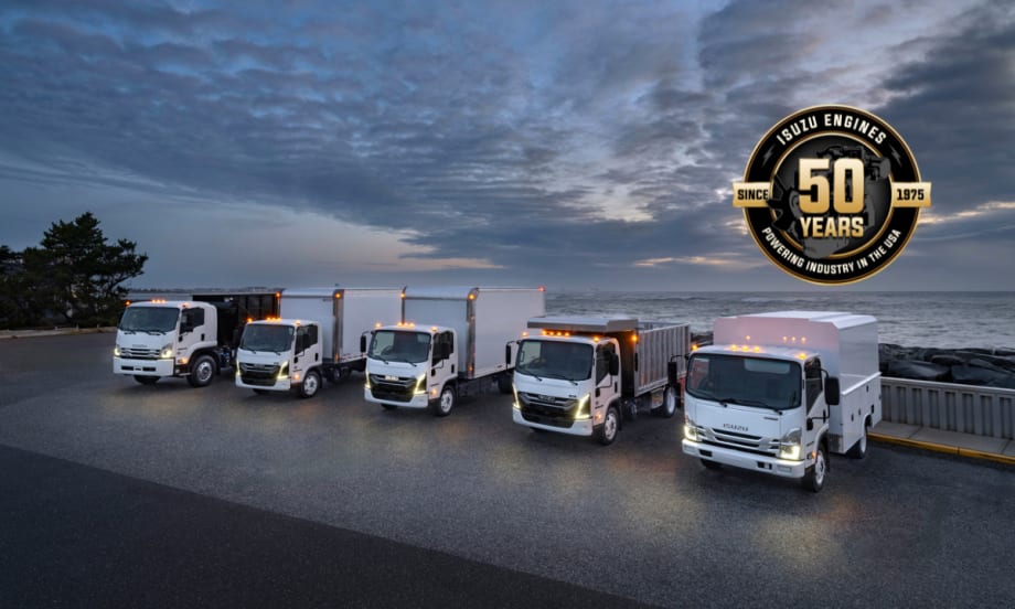 Line up of Isuzu trucks outside.