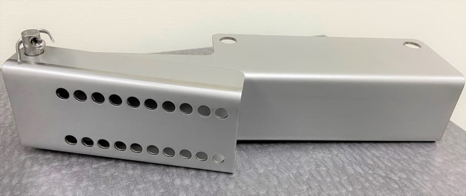 McLaren Adds Stainless-Steel Top Bracket to Door