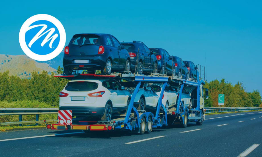 A truck transporting a load of cars.