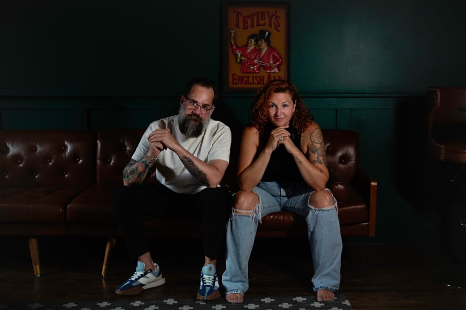 A man and a woman sitting on a couch