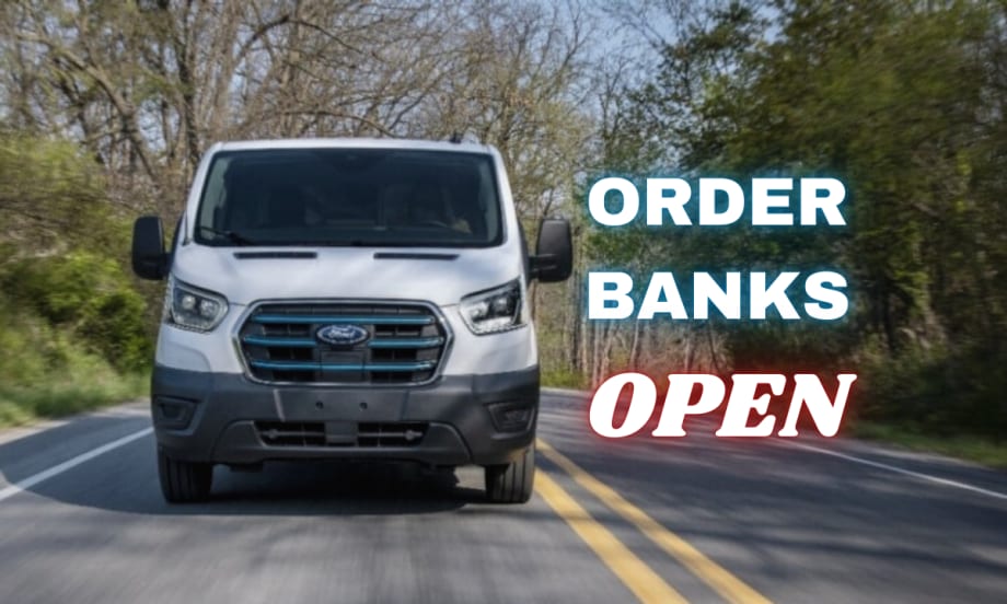 A front view of a Ford E-Transit van driving down a road surrounded by trees. Neon sign text to the right reads "Order Banks Open".