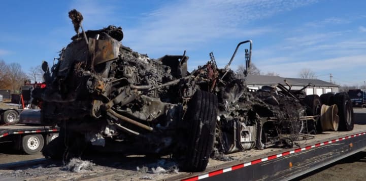 Remains of burned-up Freightliner tractor-trailer
