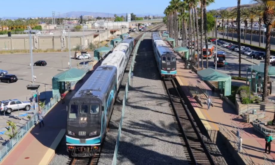 A Metrolink station with two trains.