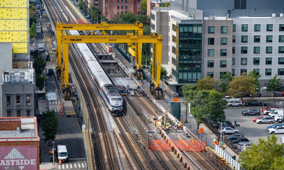 Aerial view of a Metro-North train passing through the gantry system.