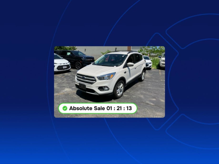 Wholesale vehicle pictured in parking lot available for real-time digital online sale.