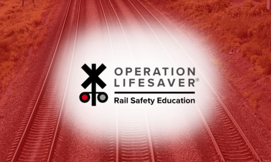 Operation Lifesaver Rail Safety Education logo over railroad tracks background, representing rail safety awareness initiatives.