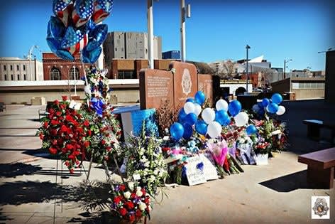 Denver Police Supporters Rally, Place Flowers at Vandalized Officer Memorial