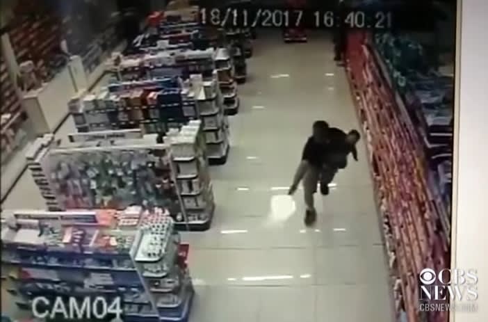 Video: Brazil MP Shoots Armed Robbers While Holding Baby