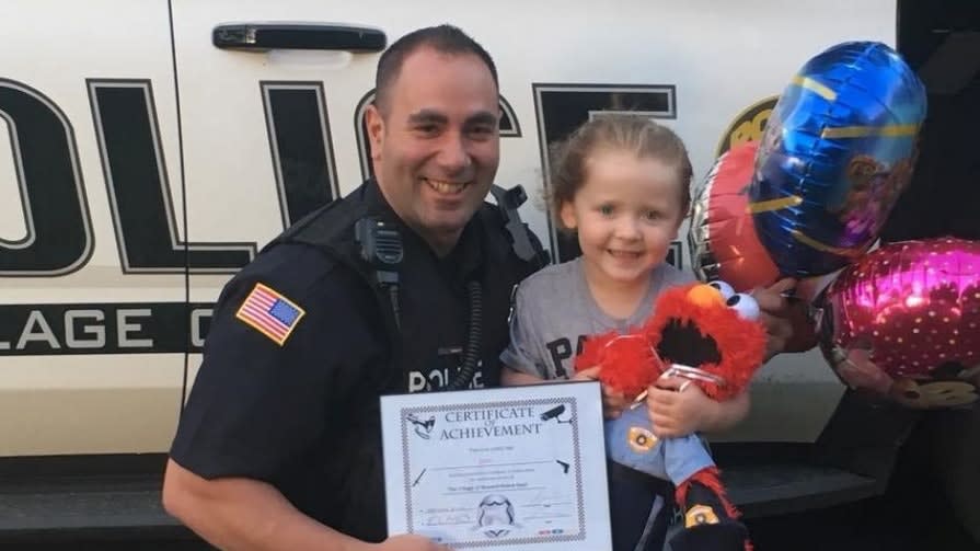 Girl Gives New York Officer Elmo Doll to Keep Him Company on Duty