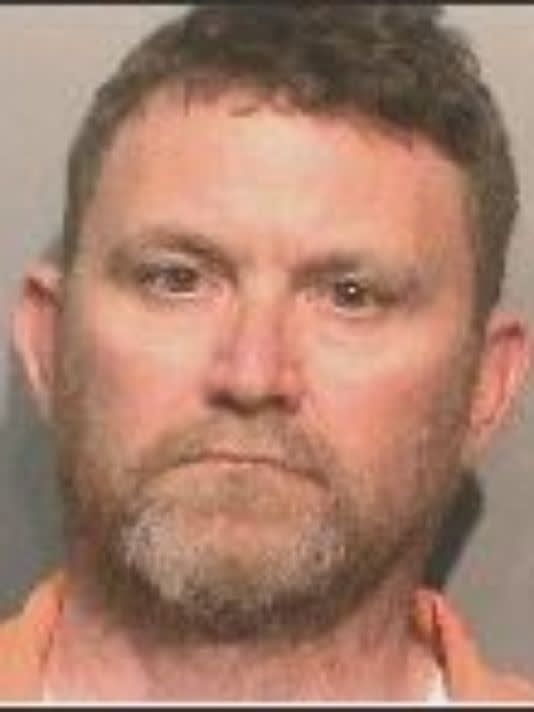 Accused Iowa Ambusher Charged with Murder, Hauled Off in Slain Officers' Cuffs