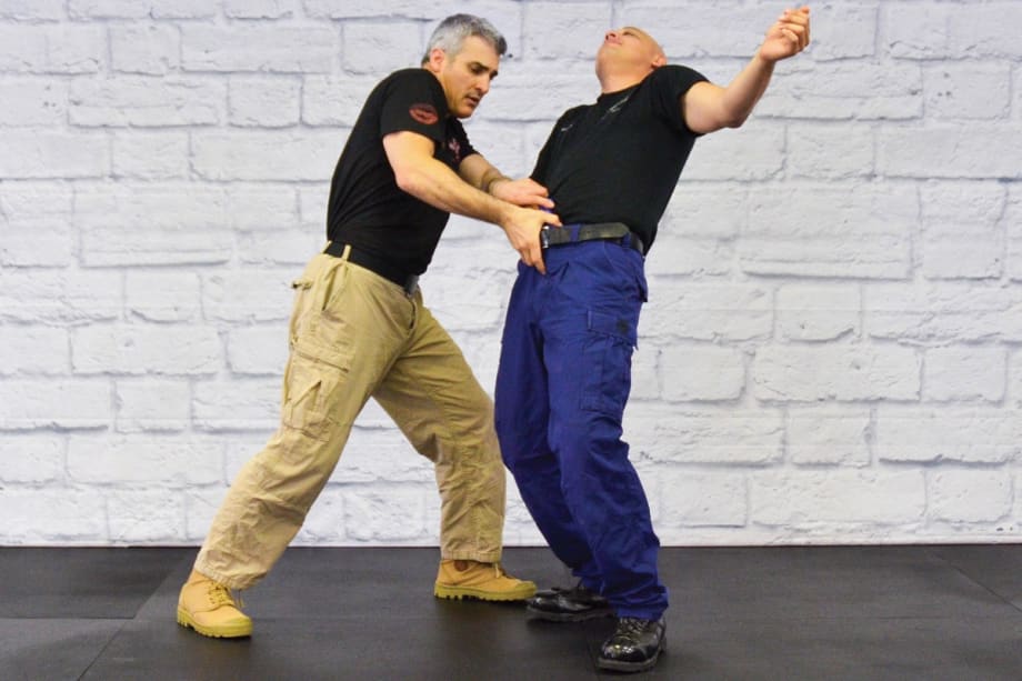 Police Krav Maga (Police KM) can be used for overall DT as well as to disarm a subject reaching for a weapon in the front of his waistband.[|CREDIT|]Photo: Rinaldo Rossi and Mimi Rowland