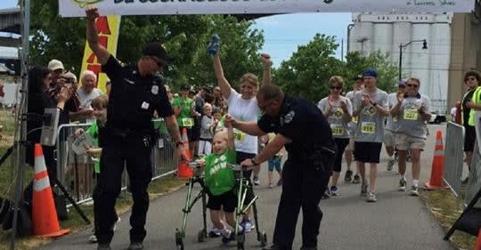 New York Officers Help 6-Year-Old Boy with Cerebral Palsy Finish Fundraising Walk