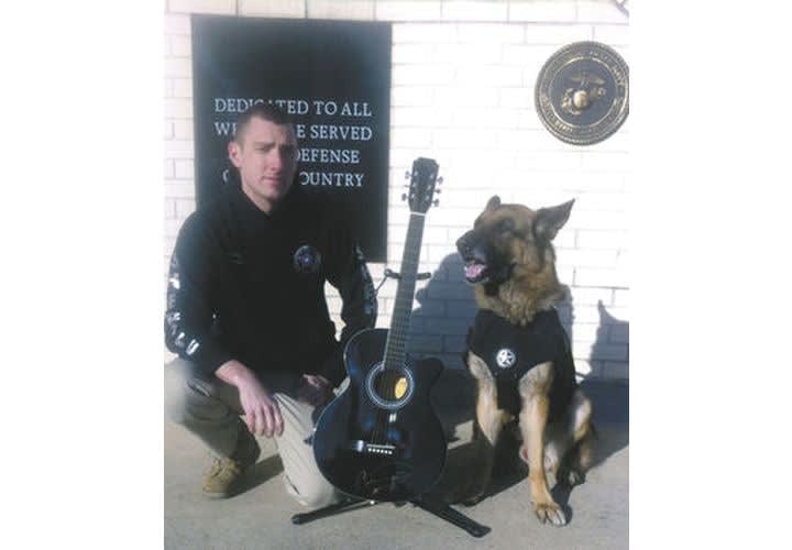 Singer Donates Guitar to Benefit Ailing Drug Dog