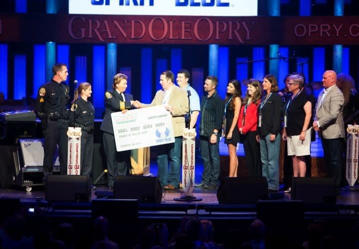 Spirit of Blue Presents Grant to Franklin PD on Grand Ole Opry Stage