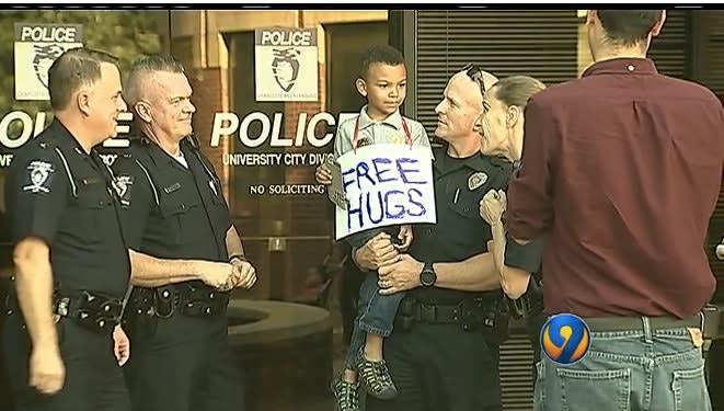 Video: Charlotte Boy Gives Officers Donuts, Hugs During Unrest