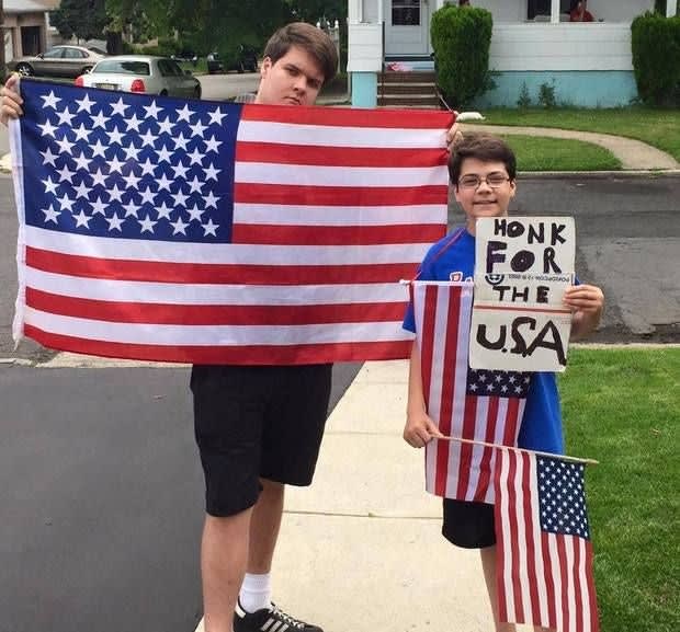 N.J. Boy's 'Honk for USA' Sign Draws Impromptu Parade From Police, Firefighters