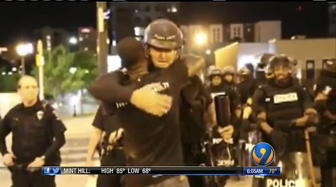Video: Man Braves Charlotte Riots to Hug Officers