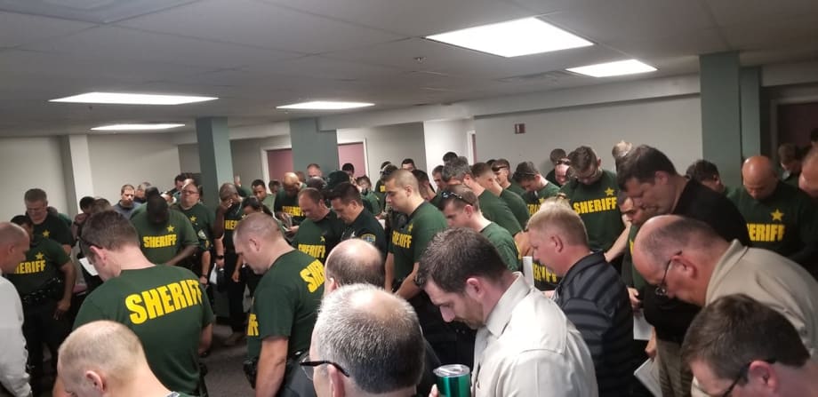 Photo: Florida Sheriff's Deputies Pause in Prayer Before Hurricane Makes Landfall