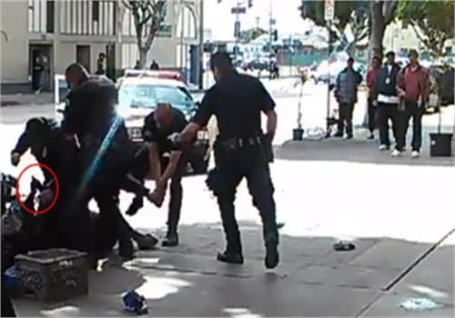 LAPD officers shot and killed a convicted bank robber Sunday after he reportedly tried to grab one of the the officers' guns.