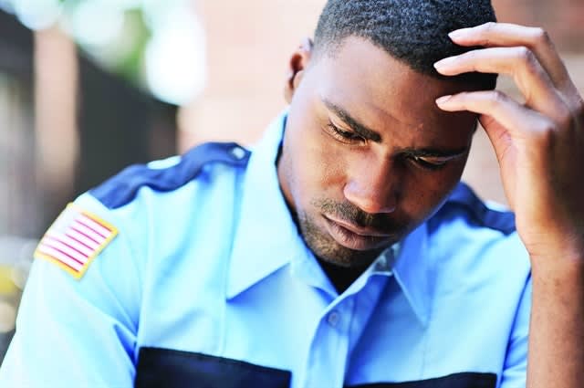 Many officers have a hard time finding somebody to talk to about what they are coping with. And most don't want to have to relive what precipitated the problem. Photo via Getty Images.