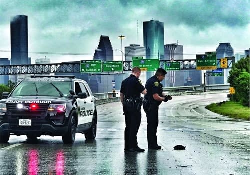 To maintain both officer and citizen safety as much as possible, Houston officers were working in a minimum of two-person teams in "cage cars" so they would have enough people on hand to help anyone they encountered as well as handle any other situations that might occur. Photo: Houston PD/Flickr