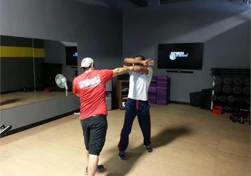 With your hands in a non-offensive position you can easily transition to this cover-up technique and to a strike.