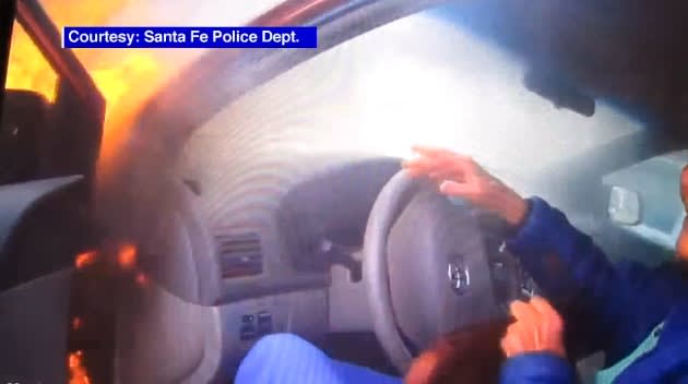Video: NM Officer Rescues Woman from Burning Car