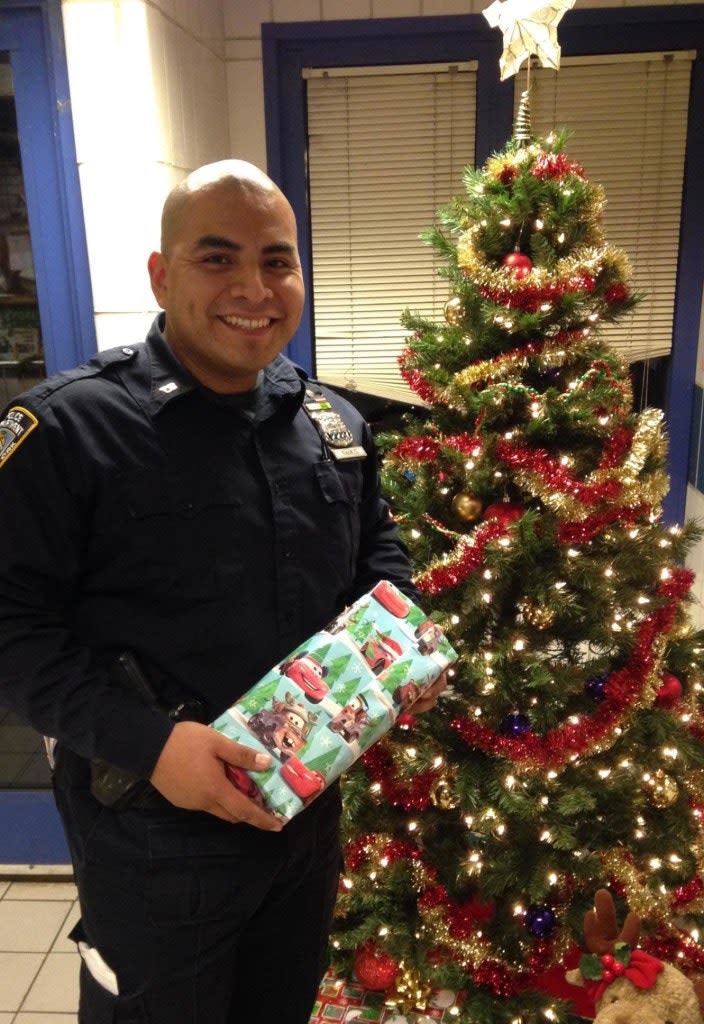 NYPD Officer Who Once Lived In a Shelter Donates Gifts to Homeless Kids