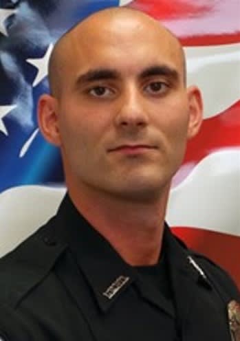 Florida Officer Was Killed With His Duty Weapon, Report Says
