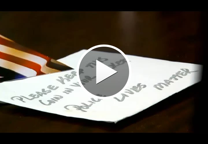 Video: 9-Year-Old Louisiana Boy Hands Out "Police Lives Matter" Envelopes to Officers