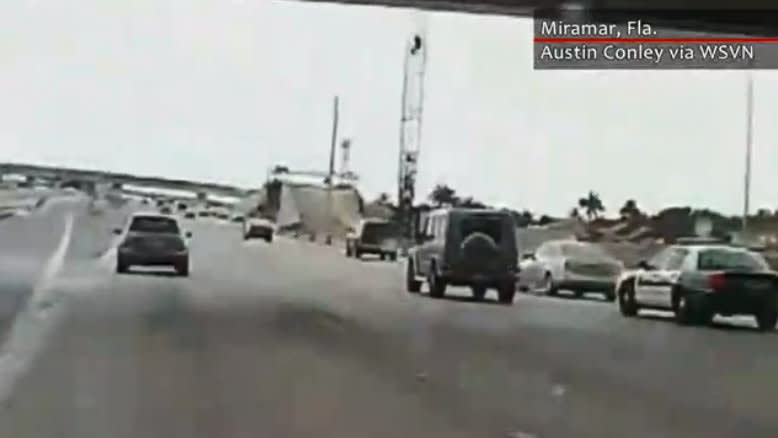 Video: Bizarre Road Rage Incident Between Police Cruiser and Car