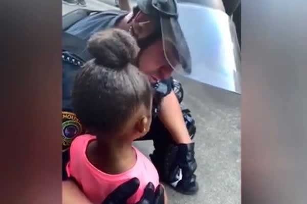 Houston Police Officer Comforts 5-Year-Old Girl at Protest