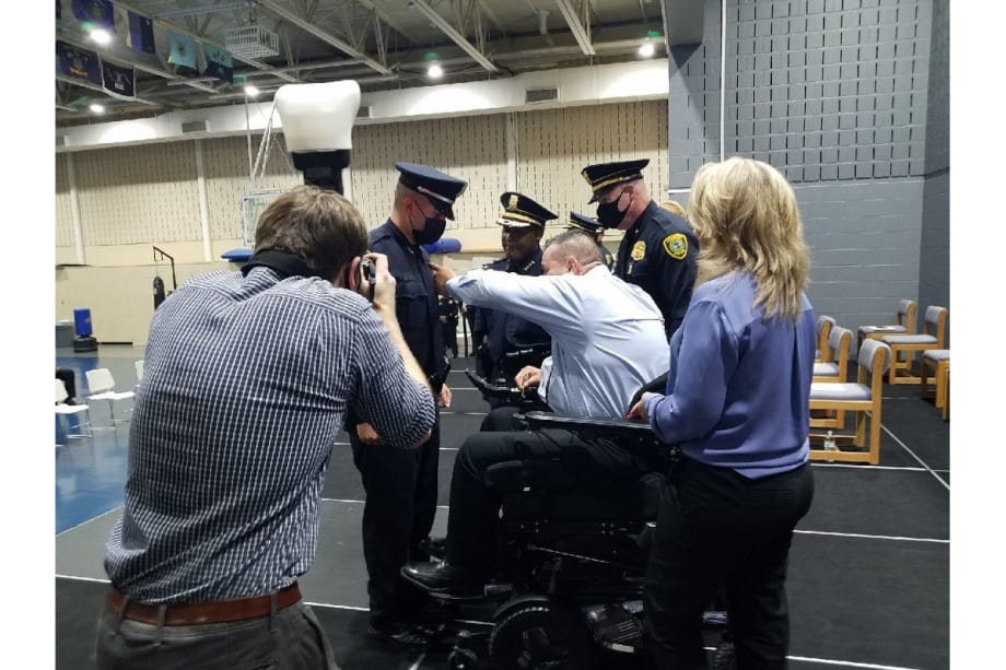 Houston Officer Paralyzed in Shooting Pins His Badge on His Son at Graduation