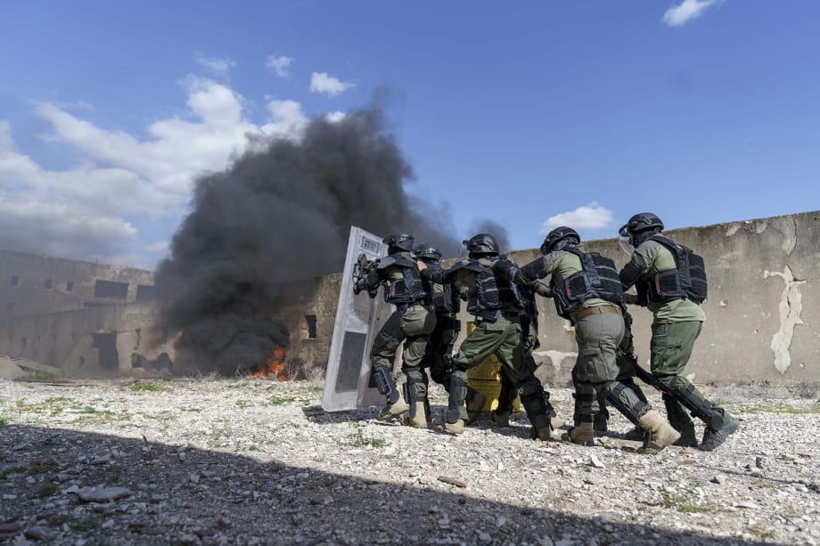 IWI Shows New Generation of Riot Control Suit at Mock Prison Riot