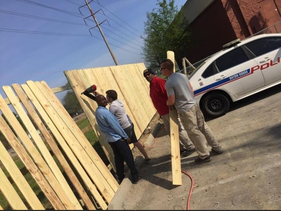 Louisiana Officers "Mend Fences" With Community Both Literally and Figuratively