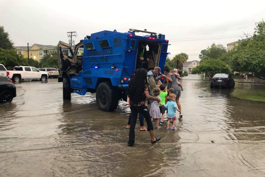 Officers Transport Flood-Stranded Daycare Kids to Parents in Armored Vehicle