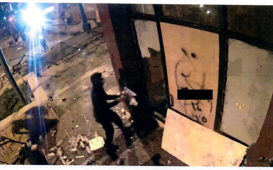 Bryce Michael Williams is reportedly the man holding the Molotov cocktail in this still from surveillance video. (Minneapolis PD)[|CREDIT|]