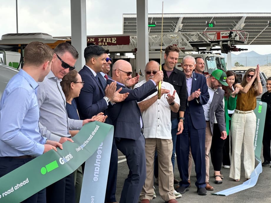 Ribbon cutting at charging depot opening.