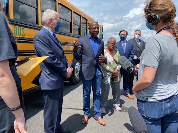 U.S. Senator Checks Out Electric School Bus Tech at Blue Bird Plant