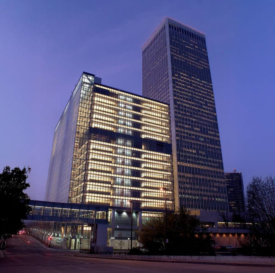 Photo of a big beautiful tall building in downtown Tulsa at sunset.