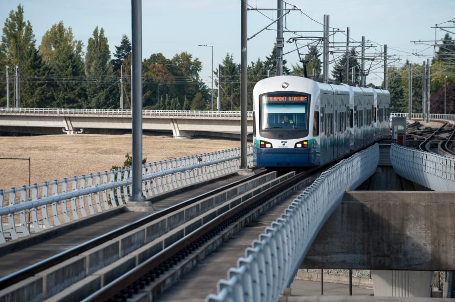 A Sound Transit train traveling along the tracks.